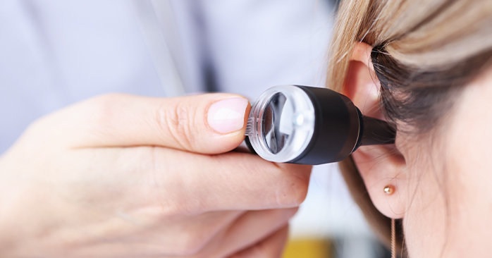 Dr. checking patients hearing